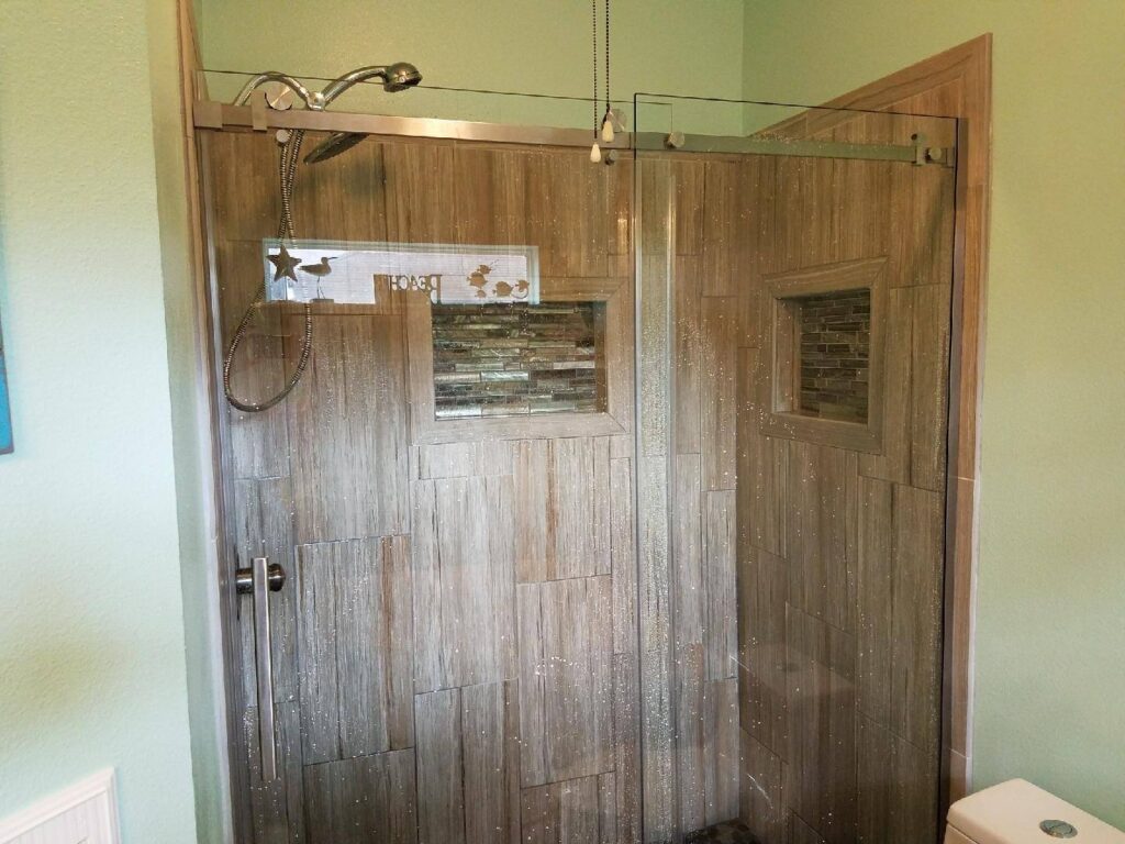 Picture of a finished shower stall showcasing the wood finish